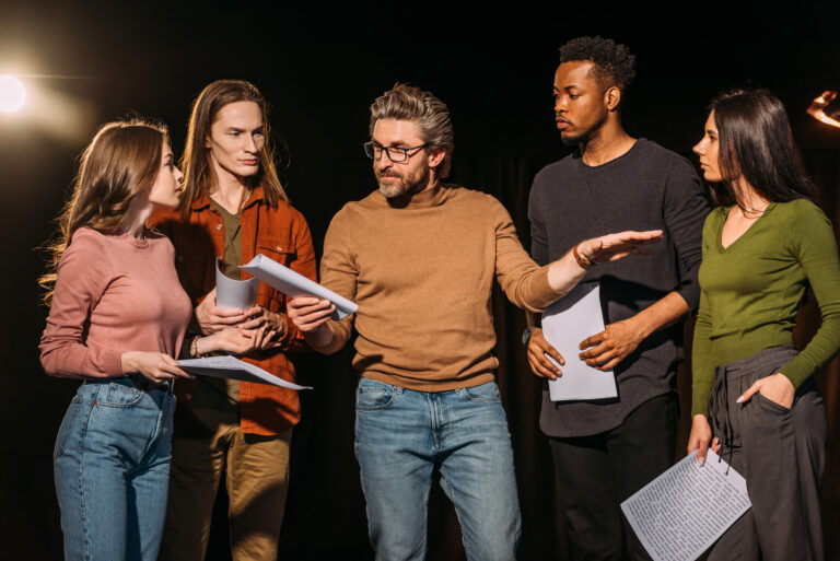Models in group rehearsal scene