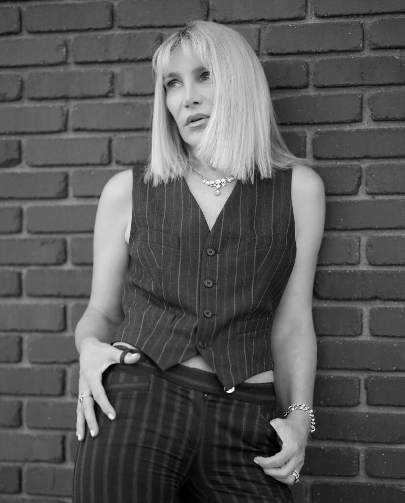 Chic monochrome model pose against brick